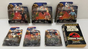Misc. Jurassic Park Collectibles Including Matchbox Die Cast Cars, Action Figures And More (New Old Stock)