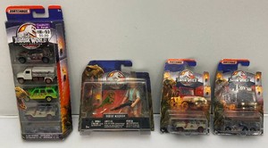 Misc. Jurassic Park Collectibles Including Matchbox Die Cast Cars, Action Figures And More (New Old Stock)