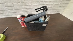 battery box with grease guns, grease, and related materials