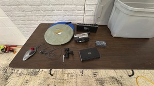 Sony Handycam camcorder, Light Diffusers, lots of cables and networking equipment.