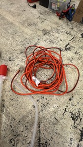 Tote with misc supplies extension cord, dock rope, fasteners, siphon, and more