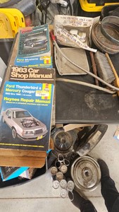 Vehicle Repair Manuals, Hubcaps, Oil Dipstick and Misc