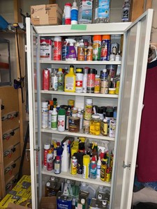 Metal Storage Cabinet with Assorted Paints Solvents Adhesives Supplies