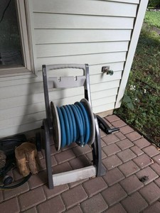 Portable Garden Hose Reel Cart with Blue Hose Hand Crank Resin Frame