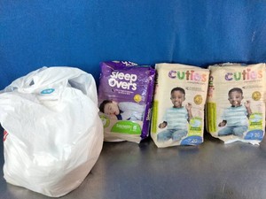Cuties Sleep Overs absorbent underwear and two packs of Cuties diapers
