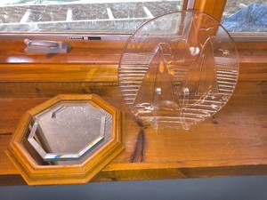 Wooden octagonal mirror and Sailboat motif glass display piece