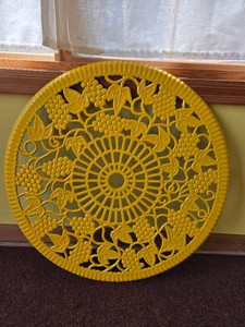 Yellow Cast Iron Trivet with Grape Leaf pattern