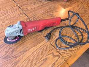 Milwaukee Electric Grinder with accessories