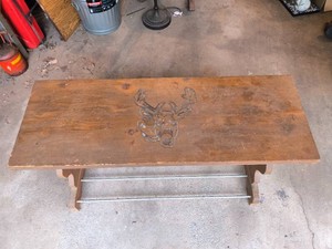 Wood bench with deer engraving