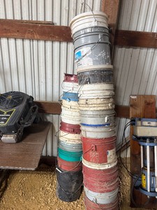 Two Stacks of Five-Gallon Buckets 20