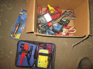 Variety of assorted battery testers and wire crimping kit