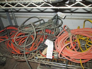 Handful of assorted length indoor and outdoor extension cords