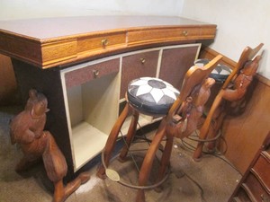 Vintage Curved wood bar with intricate carvings and nail head details. Carved Camel detail ends. Comes with matching stools