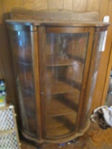 Wood curved wood China cabinet with glass doors and sides, clawfoot style feet and wood shelves includes keys