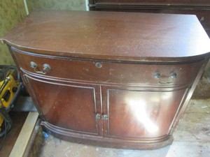 Dark wood Entry Console Cabinet with beveled front and detailed carvings