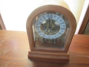 Small Wood arched mantle clock with skeleton style movement