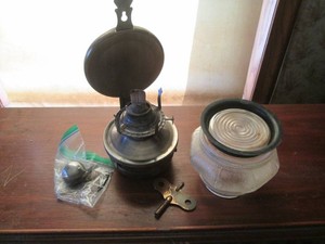 Vintage metal oil lamp with glass jar style stand and misc metal decorative hardware