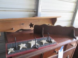 Assorted size coat hooks and wall shelves