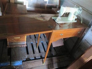 Vintage wood seamstress table with singer sewing machine