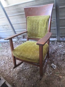 Vintage wood captains style rocking chair with velour style upholstered seat and back