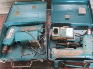 (2) Makita cordless drills with metal cases unknown functionality 