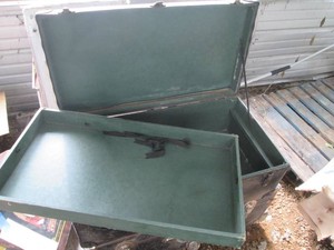Coated footlocker storage trunk with metal hardware and leather handle approx 28x16x10in