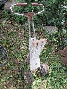Vintage rolling boat motor hauling cart