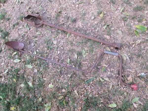 Vintage post hole digger and manual auger