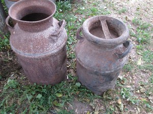 Vintage metal milk cans with lids approx 25in and 20in