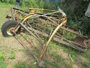 Vintage metal tractor mounting hay rake and other misc for parts, repair or scrap