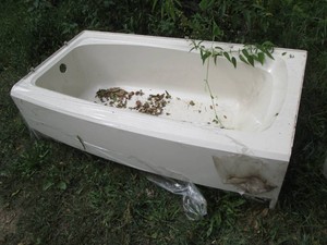 Never installed standard size left side drain bath tub