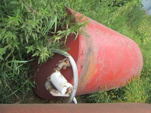 250-gallon metal gas tank we have a Bob cat to aid loading