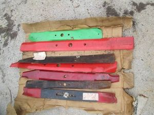 Variety of assorted size metal lawnmower blades