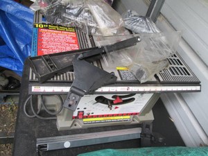 Ace 10in benchtop table saw with attachments shown