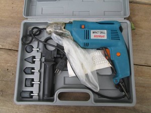 800w impact drill in hardside case with accessories shown