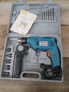800w impact drill in hardside case with accessories shown