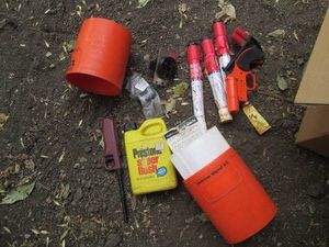Revolver style flare gun with misc shown