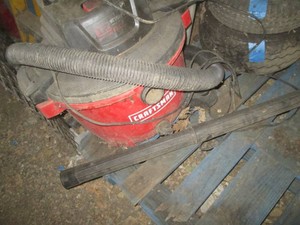 Craftsman 12-gallon shop vac with hose and accessories shown
