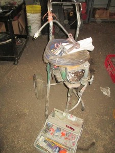 Aero industrial paint sprayer with hose, wands and tackle box loaded with a wide variety of tips and other accessories