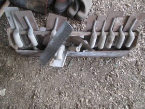 Wood tool box with lots of masonry or drywall tools