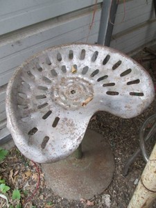 Vintage tractor seat with Metal base