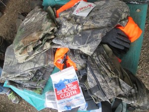 Camouflage and blaze orange hunting gear