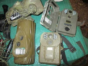 Variety of trail cams and a wild game call
