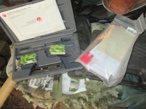 Hardside handgun cases with misc accessories and ammo