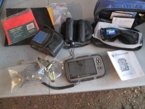 Stealth cam, solar shield glasses, ponchos, binoculars and brass tone coat hooks