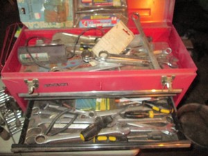 Stack on metal toolbox full of screwdrivers, wrenches, and more