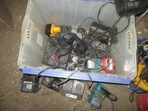 Clamshell closing tote containing assorted power tool chargers and misc batteries lllllllll