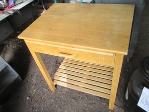 Rolling wood single drawer kitchen kart with cutting board and underneath storage approx 29x22x31 (casters unattached and inside drawer)
