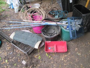 Variety of buckets containing assorted horse tack, supplies and accessories plus replacement extendable utility tool handles