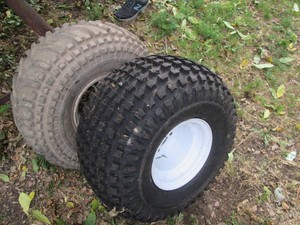 (2) Mismatch 4-lug ATVLawnmower tires one new, one preowned